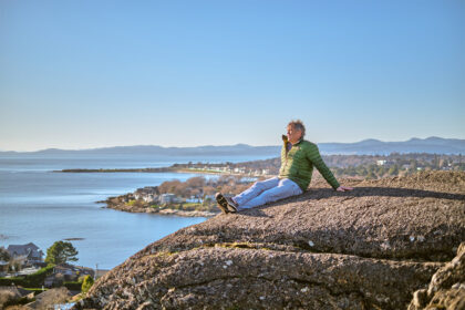 Gerald Hartwig sits along the coast, looking out at the ocean.